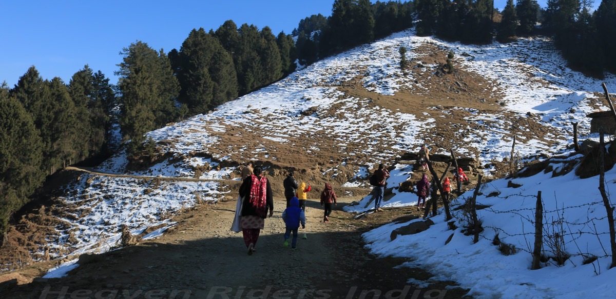 Family hiking towards Prashar Lake